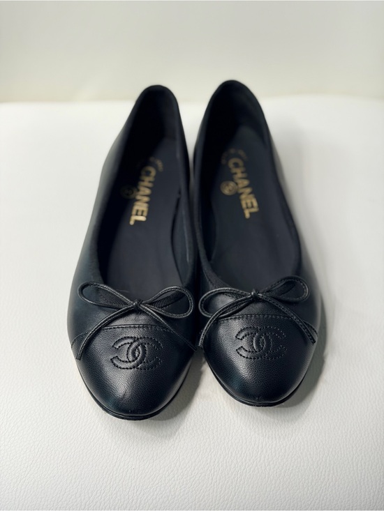 CHANEL Shoes - CHANEL Black Leather Bow Ballet Flats with Embossed CC